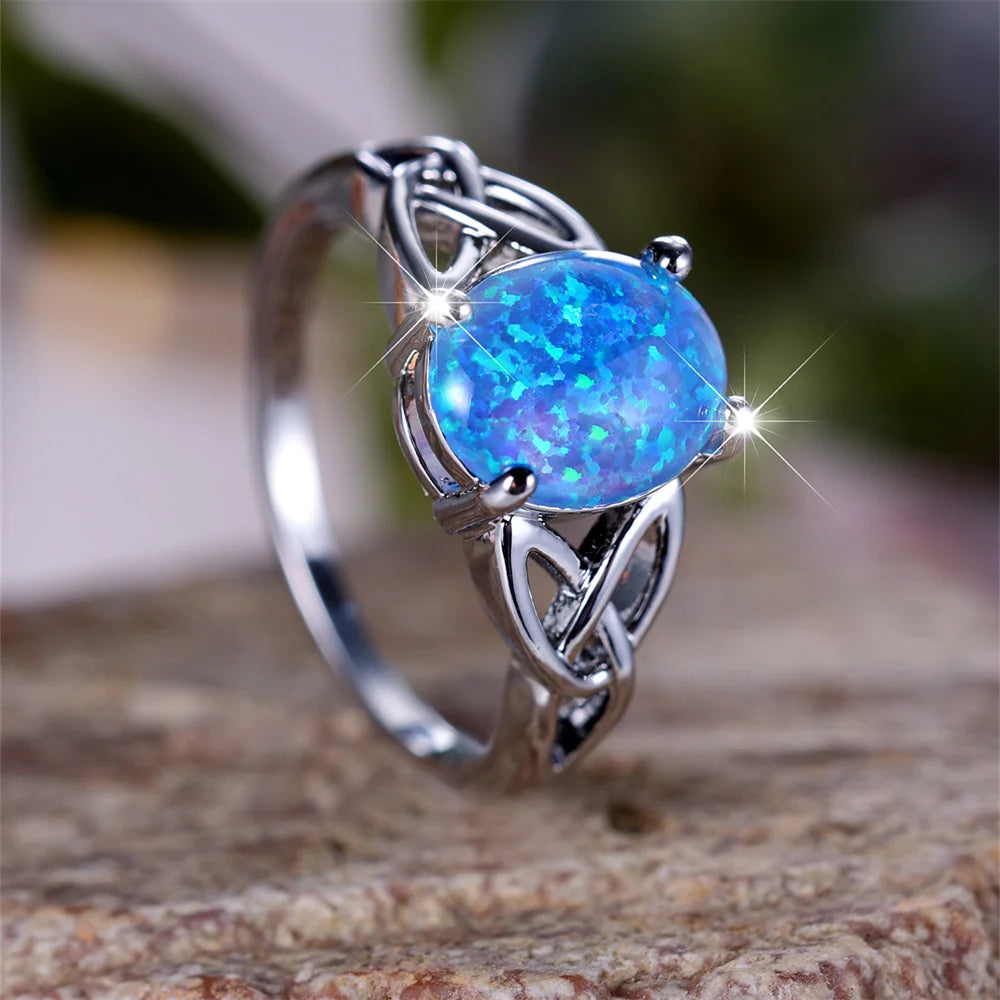 Vintage Silberfarbener Verlobungsring mit blauem Opal und Kreuzmuster für Damen