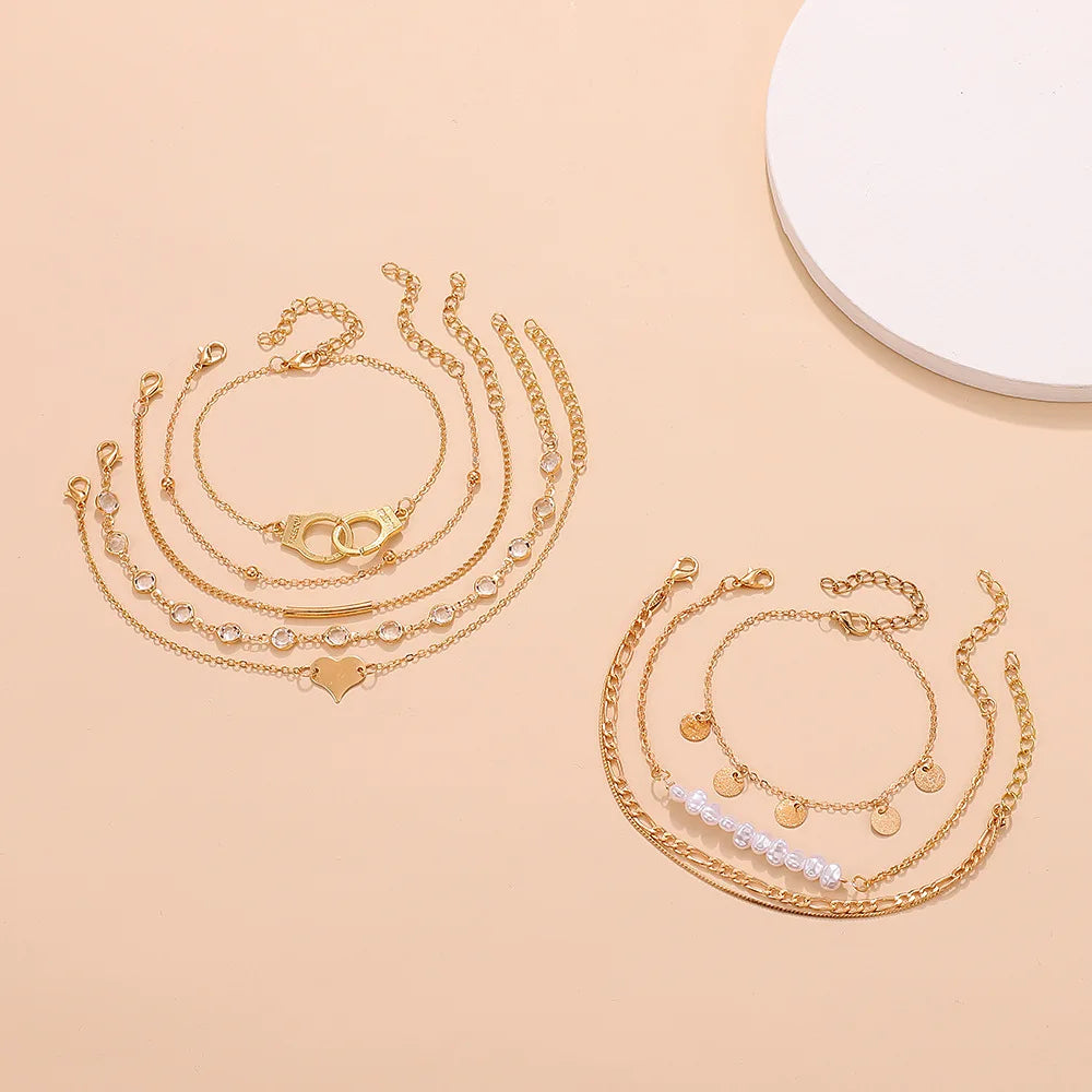 Boho Mehrschichtiges Fußkettchen für Damen mit Liebesform-Metallanhänger