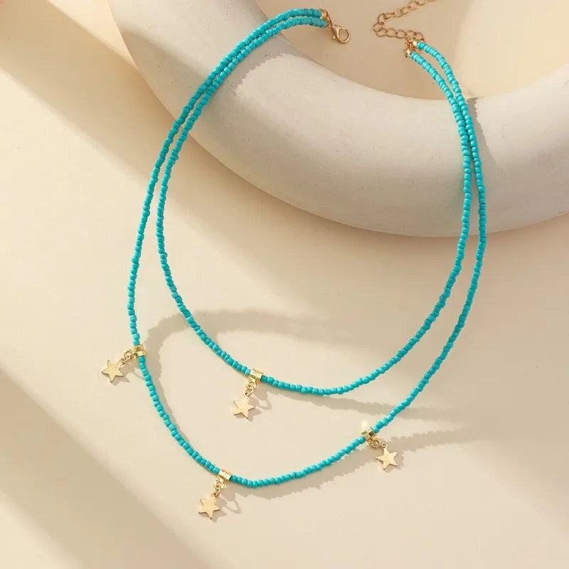 Bohemian Reisepärlchen Mehrschichtiger Pentagramm Anhänger Halskette für Frauen Mädchen Urlaub OL Geschenk Modeschmuck AN021