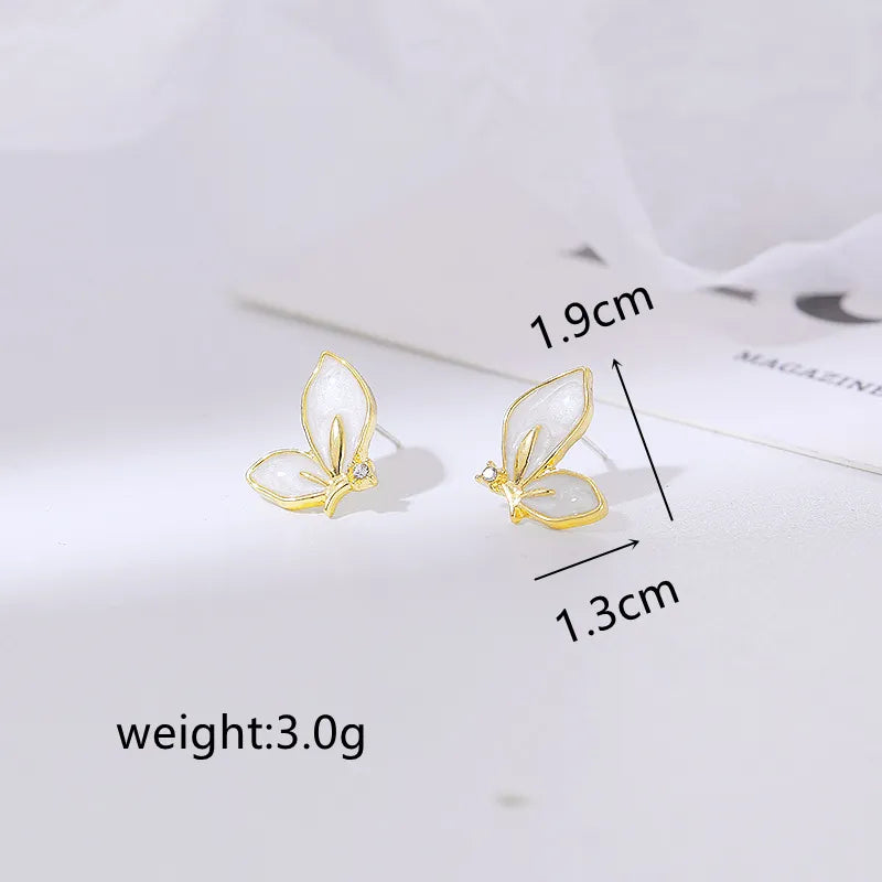 Schöne Emaille Schmetterlingsohrringe für Frauen mit goldenem Rand und Kristallen - Schmuckgeschenk