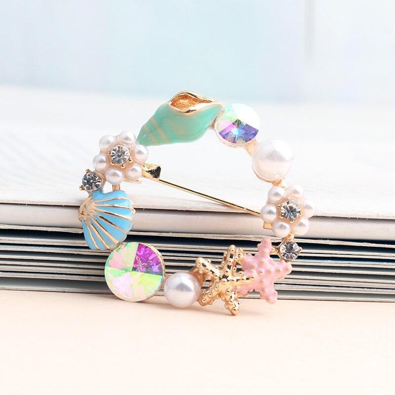 Sternenfische Und Muschelbroschen Auf Der Ozeanserie