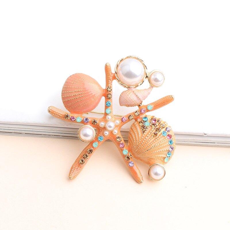 Sternenfische Und Muschelbroschen Auf Der Ozeanserie