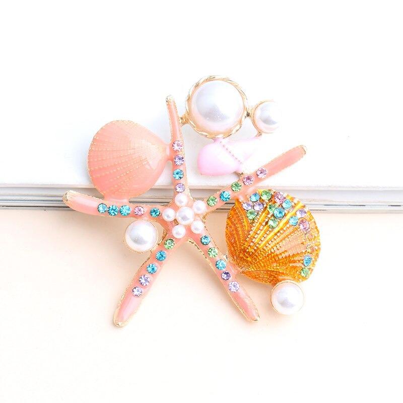 Sternenfische Und Muschelbroschen Auf Der Ozeanserie