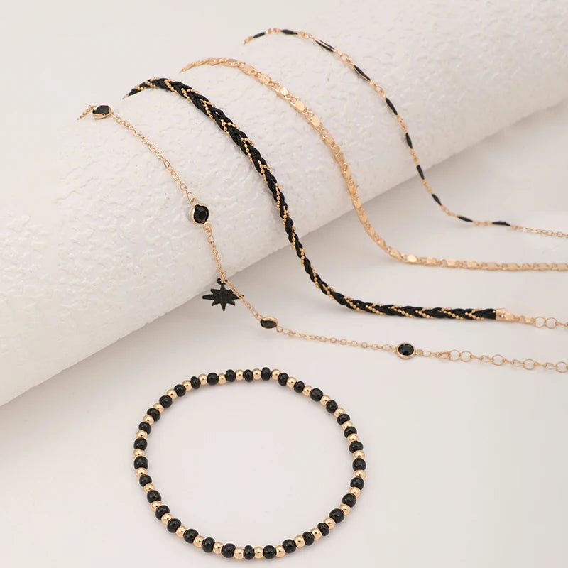 Bohemian Woven Rope Fußkettchen-Set mit geometrischen schwarzen Perlen und Tropfenöl