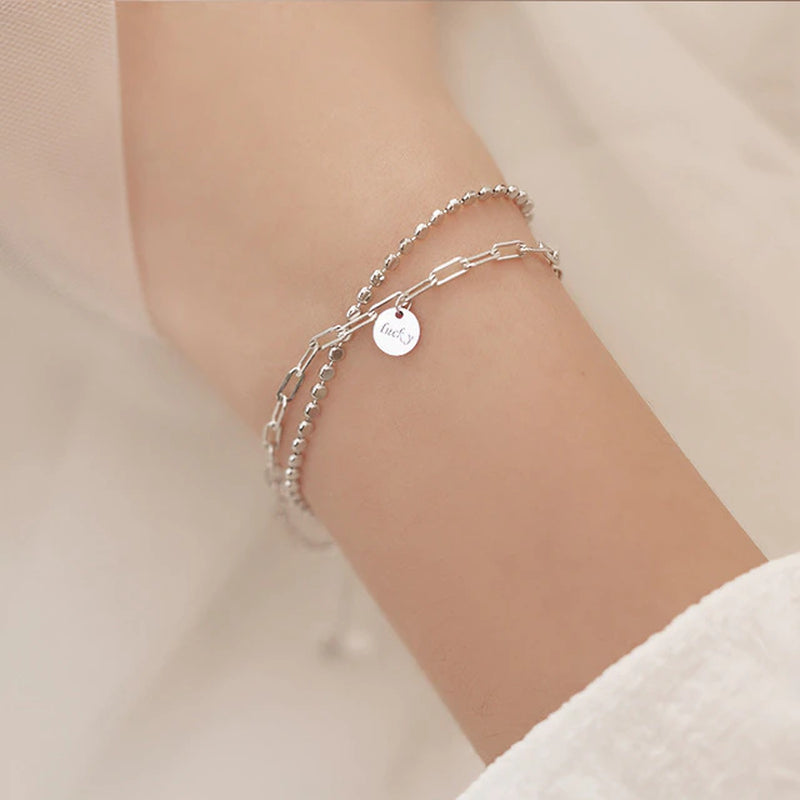 Armband aus Sterlingsilber mit doppeltem Liebesherz und hohlen runden Perlen