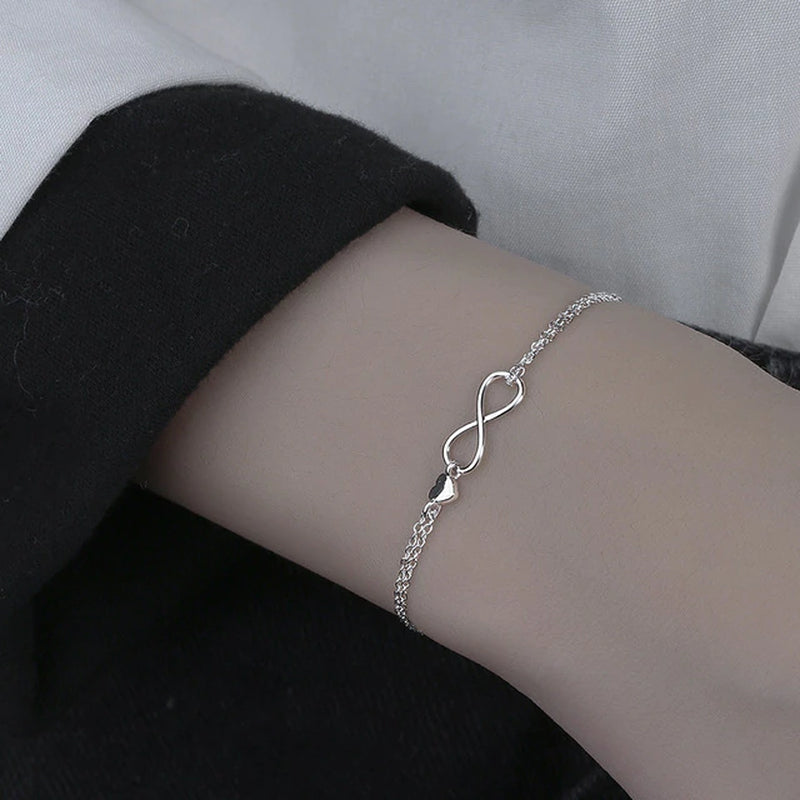 Armband aus Sterlingsilber mit doppeltem Liebesherz und hohlen runden Perlen