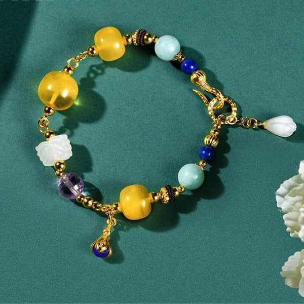 Bernsteinfarbenes Goldarmband mit mehreren Edelsteinen