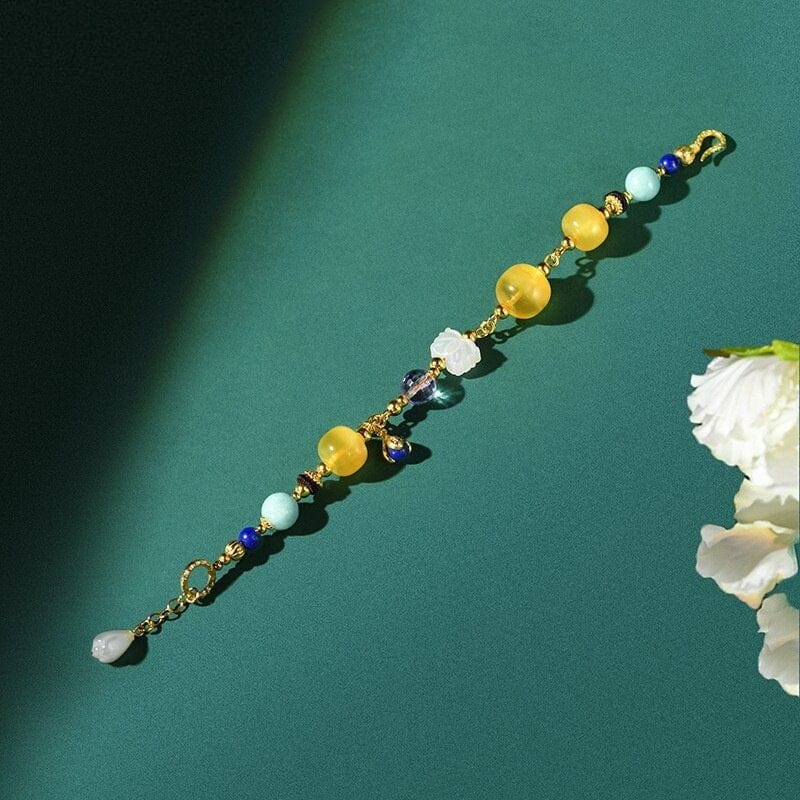 Bernsteinfarbenes Goldarmband mit mehreren Edelsteinen