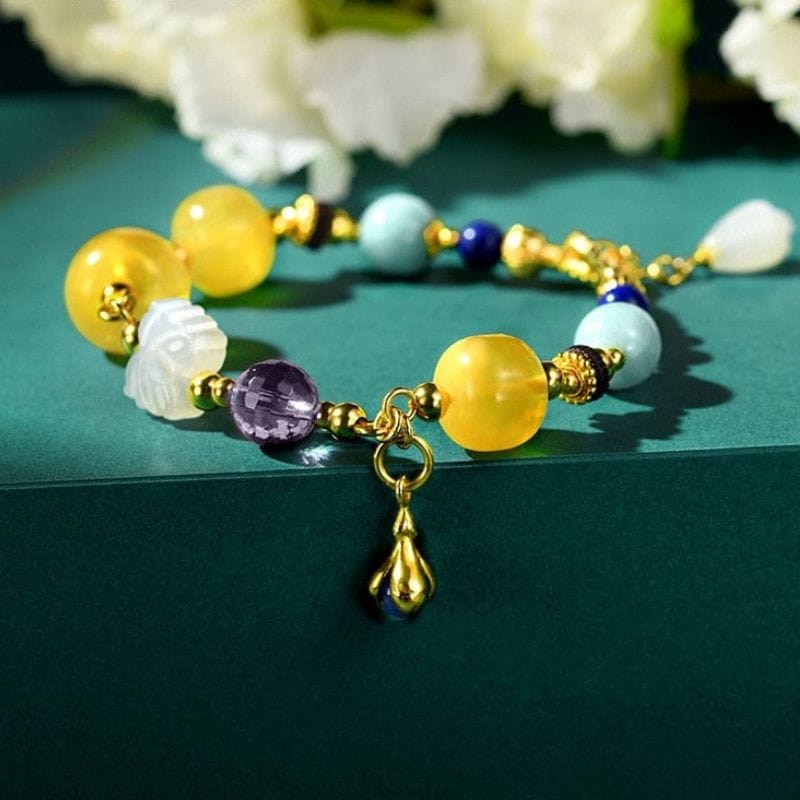 Bernsteinfarbenes Goldarmband mit mehreren Edelsteinen