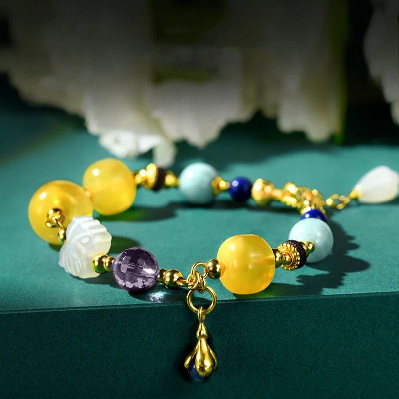 Bernsteinfarbenes Goldarmband mit mehreren Edelsteinen