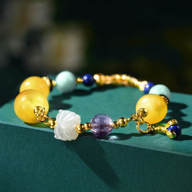 Bernsteinfarbenes Goldarmband mit mehreren Edelsteinen