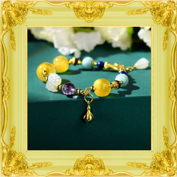 Bernsteinfarbenes Goldarmband mit mehreren Edelsteinen