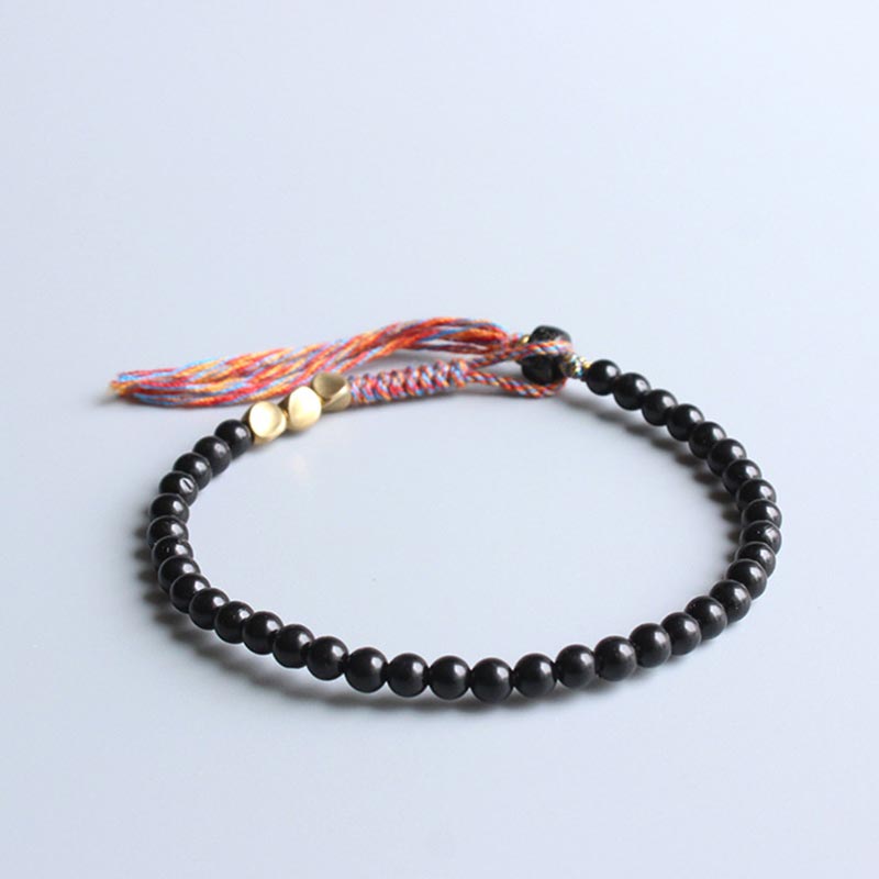 Handgefertigtes Chavri-Quastenarmband aus tibetischem schwarzem Onyx