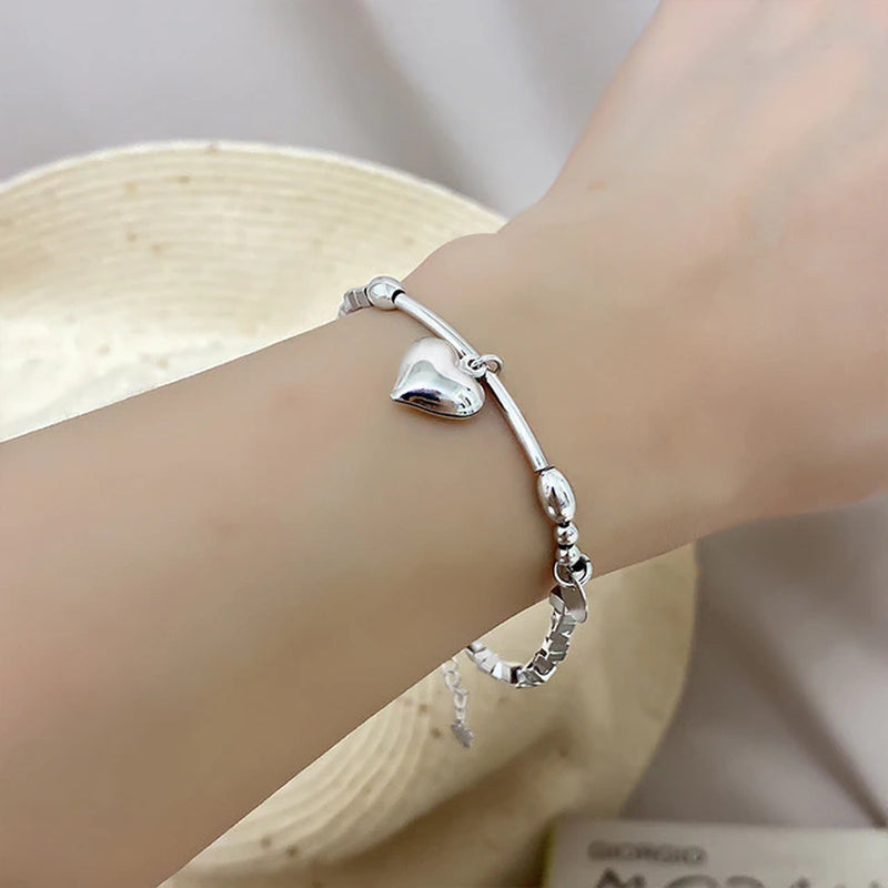 Armband aus Sterlingsilber mit doppeltem Liebesherz und hohlen runden Perlen