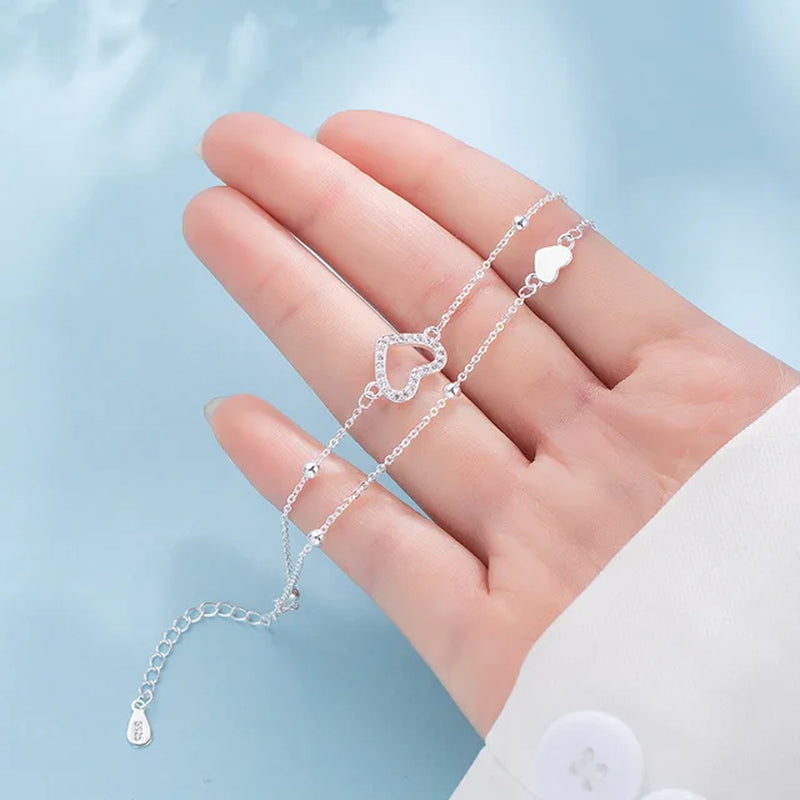 Armband aus Sterlingsilber mit doppeltem Liebesherz und hohlen runden Perlen